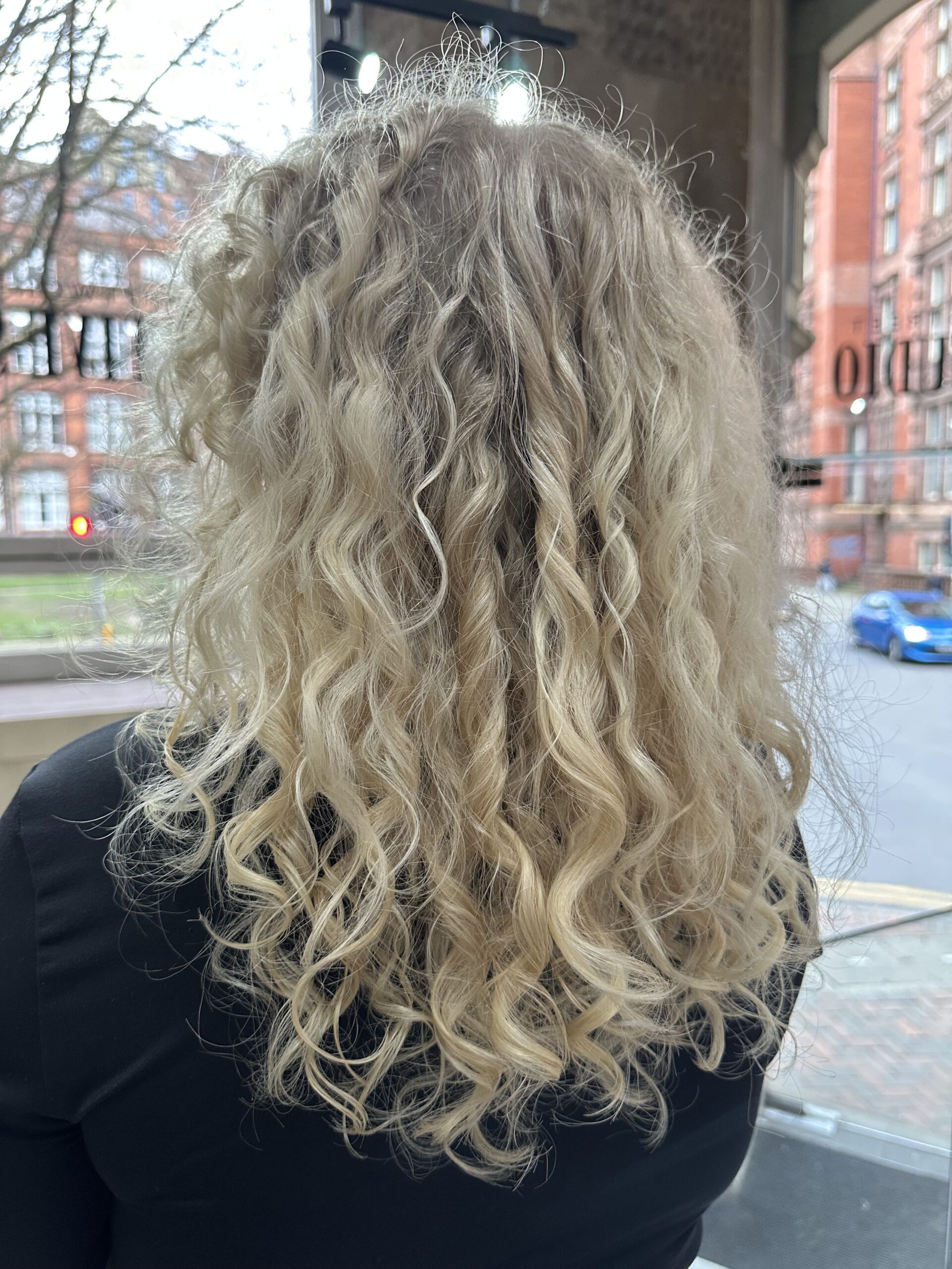 close-curly-hair close up of blonde curly hair behind head