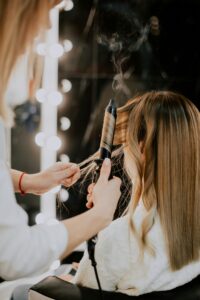 someone getting there hair curled