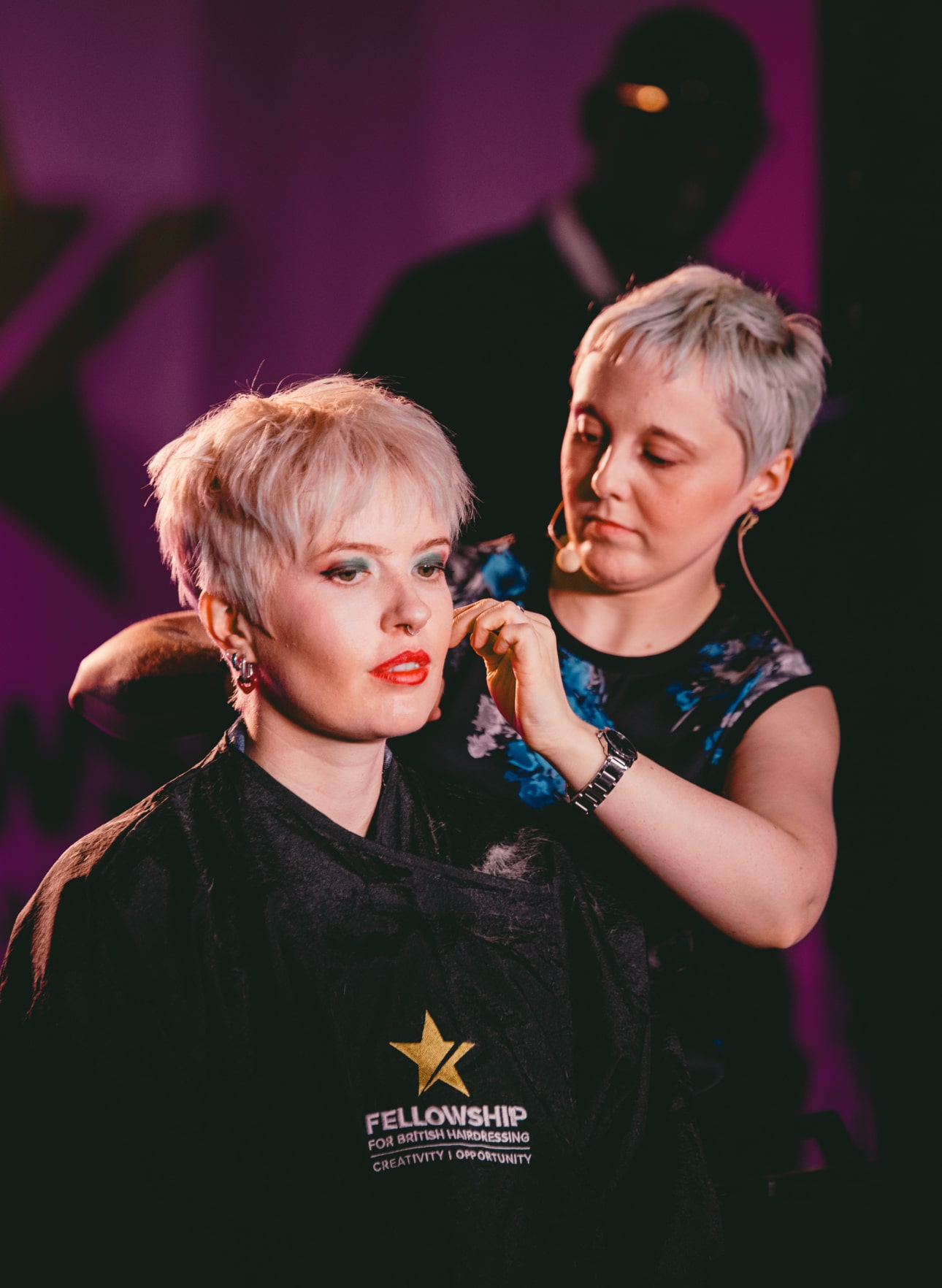 rebecca johnston cutting a model's hair on stage at manchester hair con