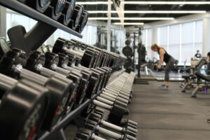 dumbbells in a gym woman weight lifting