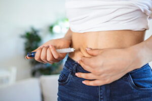 woman injecting her stomach